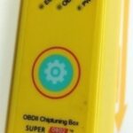 Close-up of a ChipPower OBD2 tuning box, marketed for car performance enhancement.