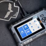 Hands-on review of the Topdon ArtiDiag500 OBD2 scanner, a budget-friendly tablet-style scan tool showing diagnostic data on its display, perfect for car enthusiasts and home mechanics.