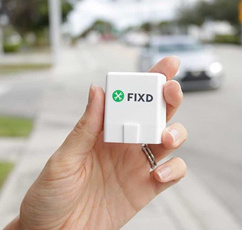 Image showcasing the compact dimensions of the FIXD OBD2 scanner, emphasizing its lightweight and discreet design.