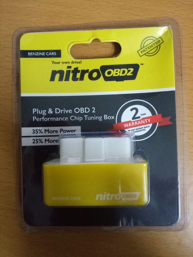 Nitro OBD2 chip front and back view showcasing compact design for easy OBD2 port connection.