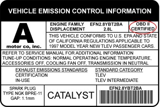 Example of an OBD-II compliance sticker on a vehicle